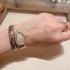 BVLGARI SERPENTI Series 103648 (Two-Tone, Stainless Steel & 18K Gold, Diamond Bezel, White Lacquered Dial, Pink Spinel Crown, Swiss Quartz Movement)
