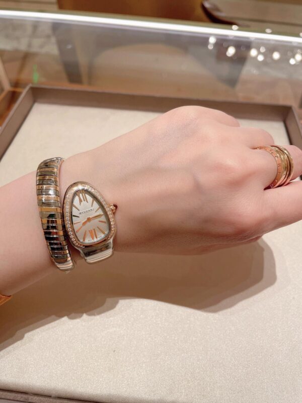 BVLGARI SERPENTI Series 103648 (Two-Tone, Stainless Steel & 18K Gold, Diamond Bezel, White Lacquered Dial, Pink Spinel Crown, Swiss Quartz Movement)